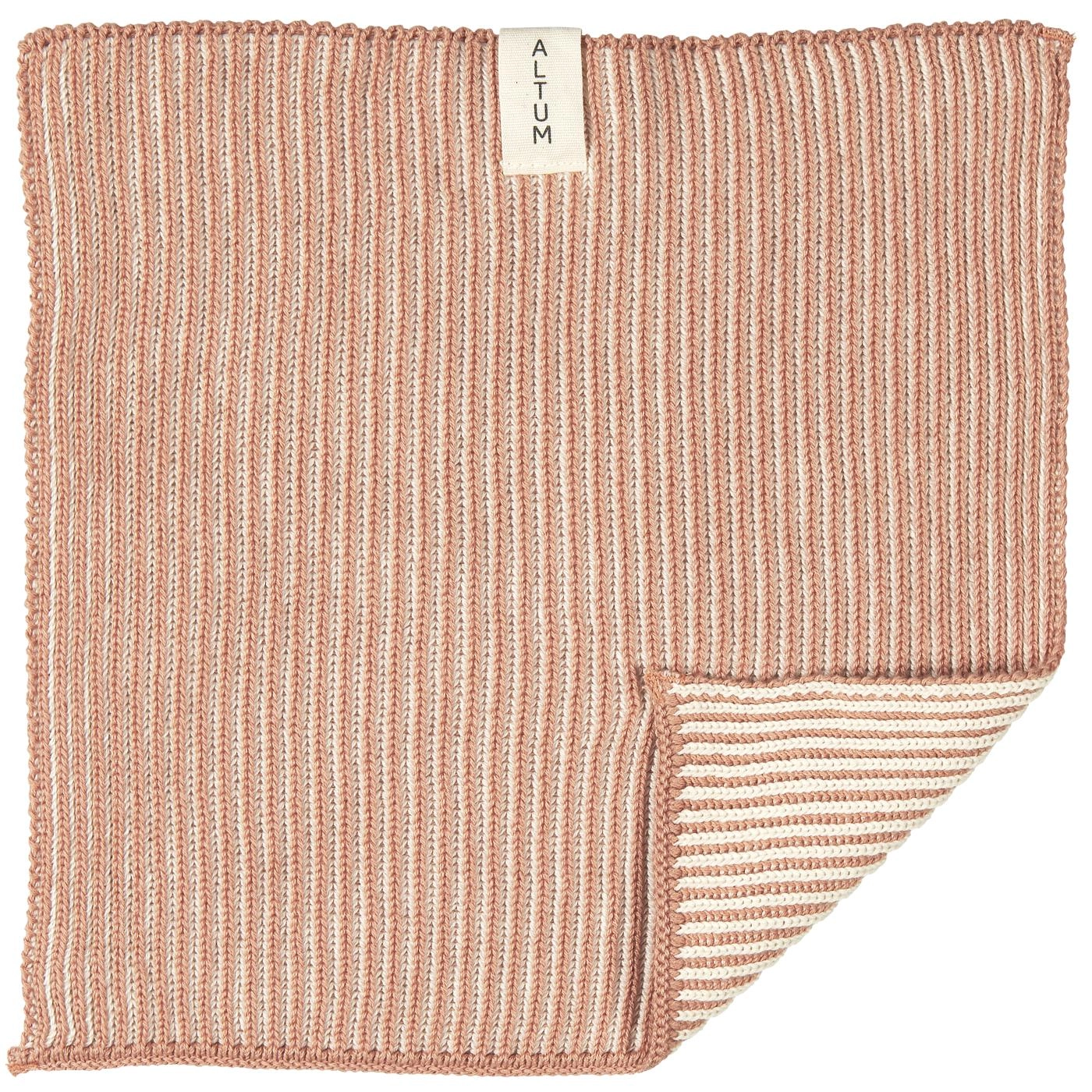 Paño esponja Altum Nude extendido, con tejido de rayas y una esquina doblada.