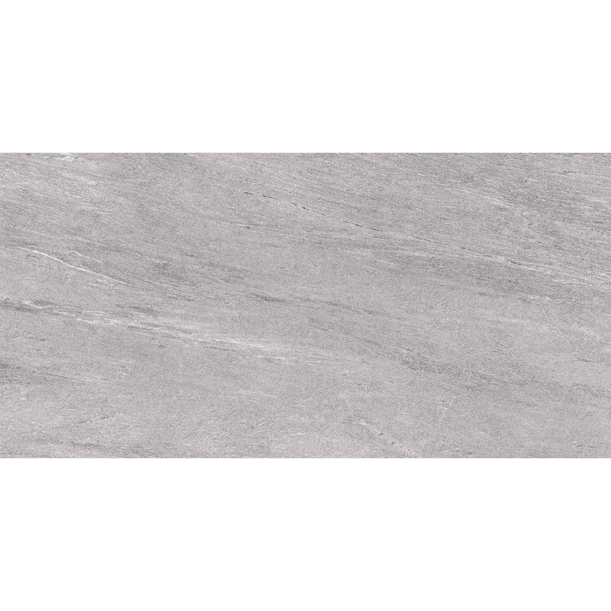 Porcelanato gris tipo piedra mate, visto de cerca con vetas y variaciones sutiles.